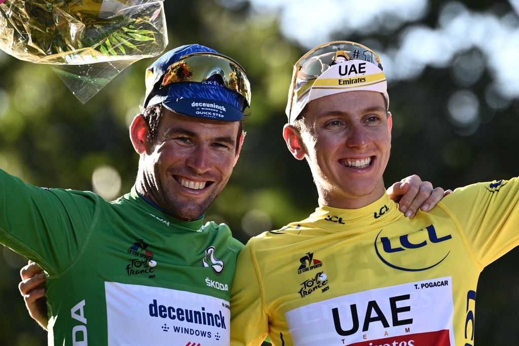 Winner Team UAE Emirates Tadej Pogacar R of Slovenia celebrates his overall leader yellow jersey and Team Deceuninck Quicksteps Mark Cavendish L of Great Britain celebrates his green jersey of best sprinter on the podium at the end of the 21th and last stage of the 108th edition of the Tour de France cycling race 108 km between Chatou and Paris ChampsElysees on July 18 2021 Photo by AnneChristine POUJOULAT AFP Photo by ANNECHRISTINE POUJOULATAFP via Getty Images