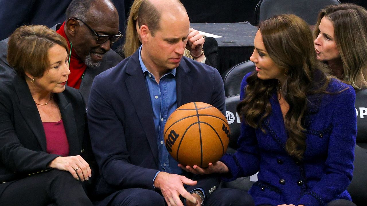 Massachusetts Governor-elect Maura Healey (L) watches as Britain&#039;s Prince William is handed a basketball by Catherine, Princess of Wales during the National Basketball Association game between the Boston Celtics and the Miami Heat at TD Garden in downtown Boston,on November 30, 2022.