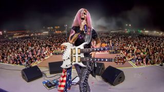 Lita Ford performs live with a B.C. Rich double-neck