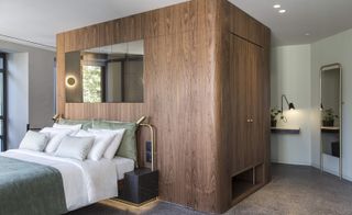 Guestroom with large wooden feature