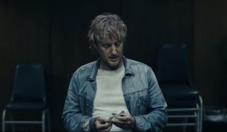 Bliss Owen Wilson holding a picture during his support meeting