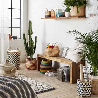 room filled with decorative baskets of plants