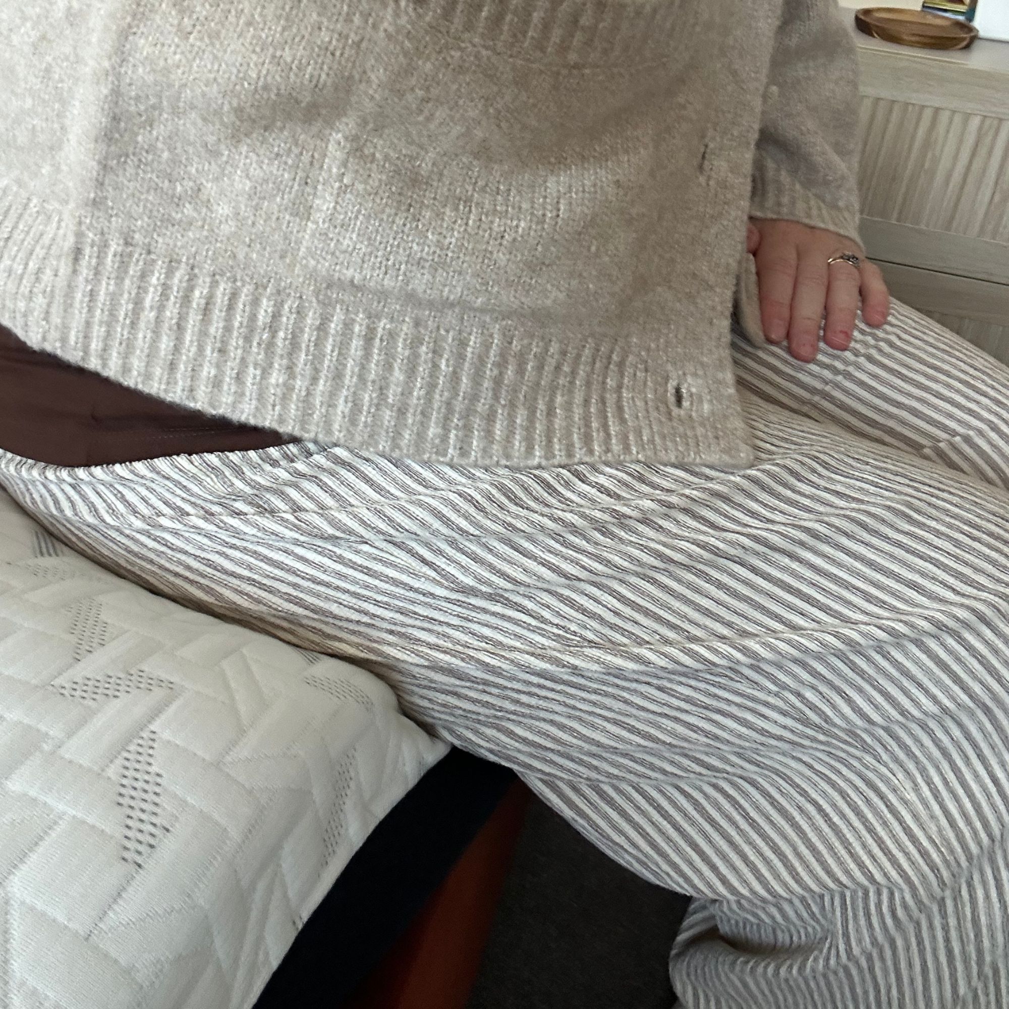 Edge support testing on Nectar mattress - Annie sat on edge