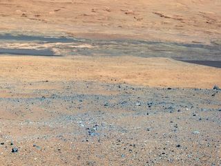 This image from NASA's Curiosity rover looks south of the rover's landing site on Mars towards Mount Sharp. This is part of a larger,high-resolution color mosaic made from images obtained by Curiosity's Mast Camera. Image released August 14, 2012.