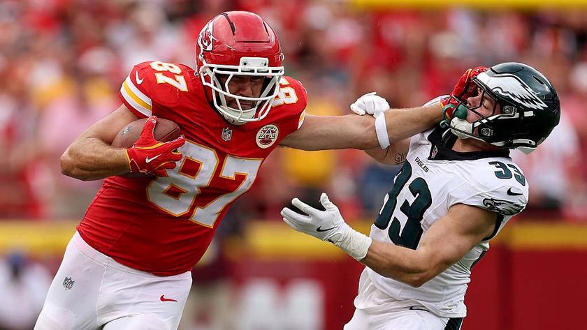 KANSAS CITY, MISSOURI - SEPTEMBER 14: Travis Kelce #87 of the Kansas City Chiefs stiff arms Cooper DeJean #33 of the Philadelphia Eagles during the third quarter in the game at Arrowhead Stadium on September 14, 2025 in Kansas City, Missouri. (Photo by Jamie Squire/Getty Images)