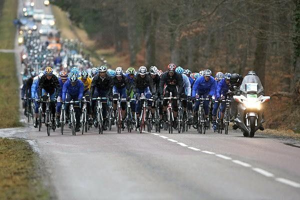 The bunch huddles together in the rain.