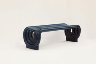 The Ourobobos bench, made of oxidized oak inlaid with blue paint