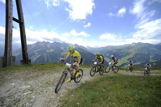 The riders crest the the climb in beautiful German weather.
