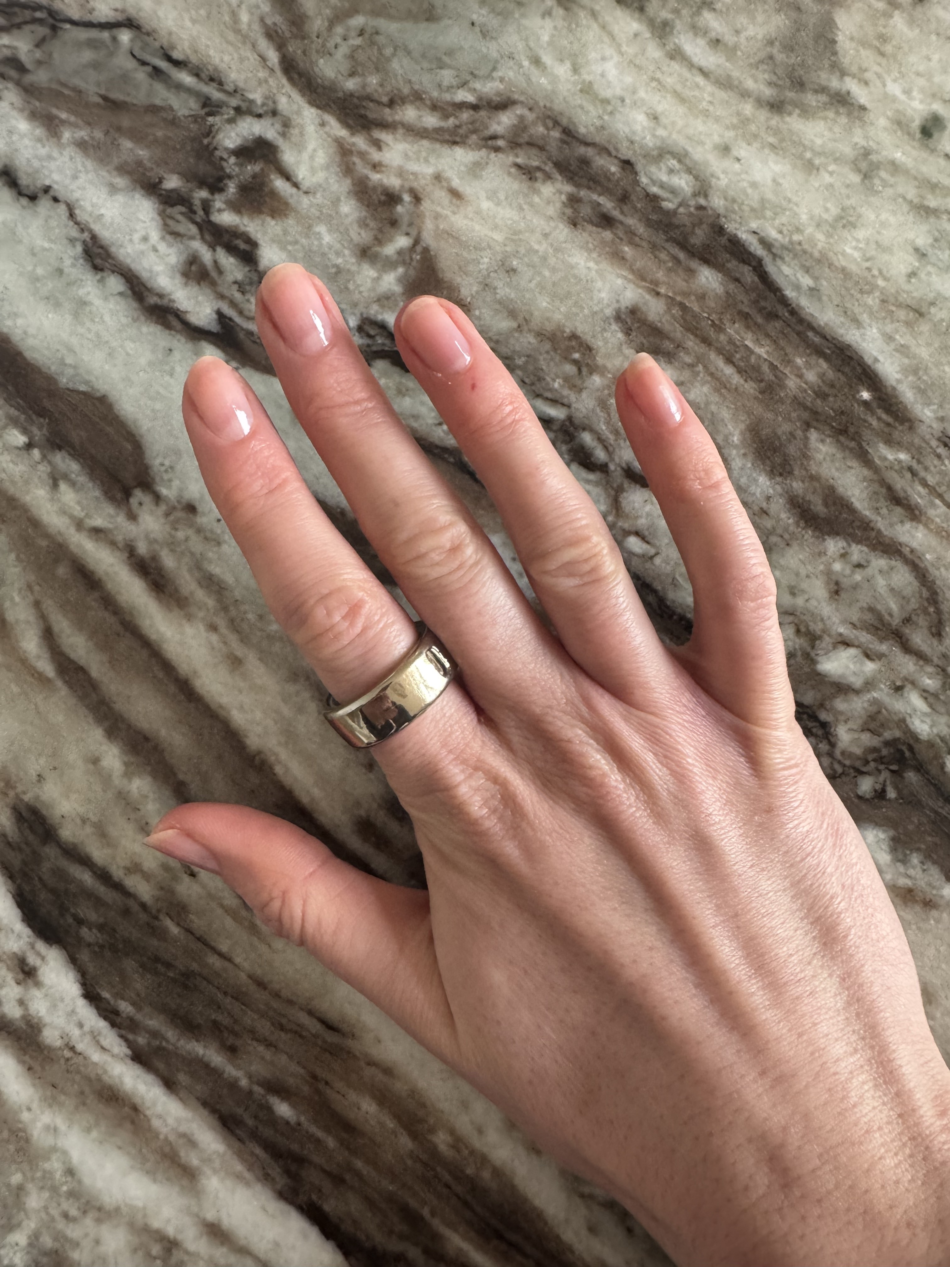 Eleanor's nails painted with one coat of Essie Glass Nails polish in shade Cin Cin