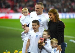Wayne Rooney of England, his wife Coleen Rooney and their children Kit Joseph Ronney, Klay Anthony Rooney, Kai Wayne Rooney and Cass Mac Rooney pose for a photo pitside prior to the International Friendly match between England and United States at Wembley Stadium on November 15, 2018 in London, United Kingdom. (Photo by Mike Hewitt/Getty Images)