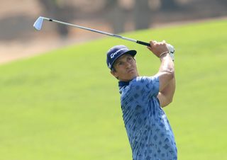 Thorbjorn Olesen watches his approach shot