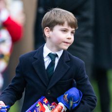 Prince Louis wears a navy overcoat and a suit to church in Sandringham on Christmas Day 2024