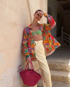 Colourful blouse and pink bag