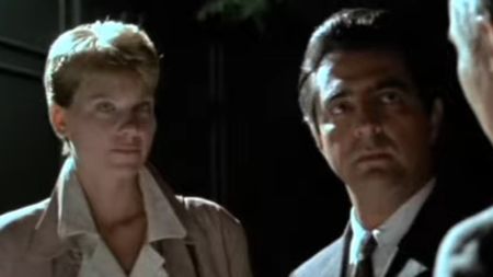 Lindsay Crouse and Joe Mantegna in a night time setting in House of Games
