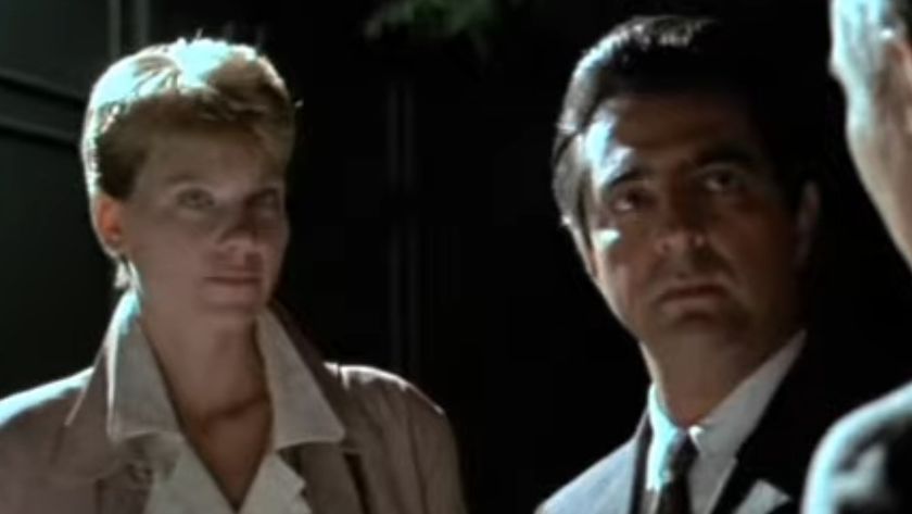 Lindsay Crouse and Joe Mantegna in a night time setting in House of Games
