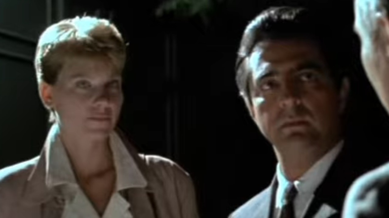 Lindsay Crouse and Joe Mantegna in a night time setting in House of Games