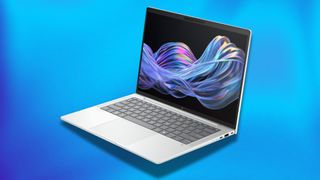 A silver HP EliteBook Ultra G1i in front of a blue background