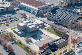 everson museum of art east wing redesign by MILLIONS concrete geometric volumes and colourful soft interiors and planters