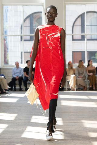 a model walks the spring 2025 Proenza Schouler runway wearing the legging layering trend