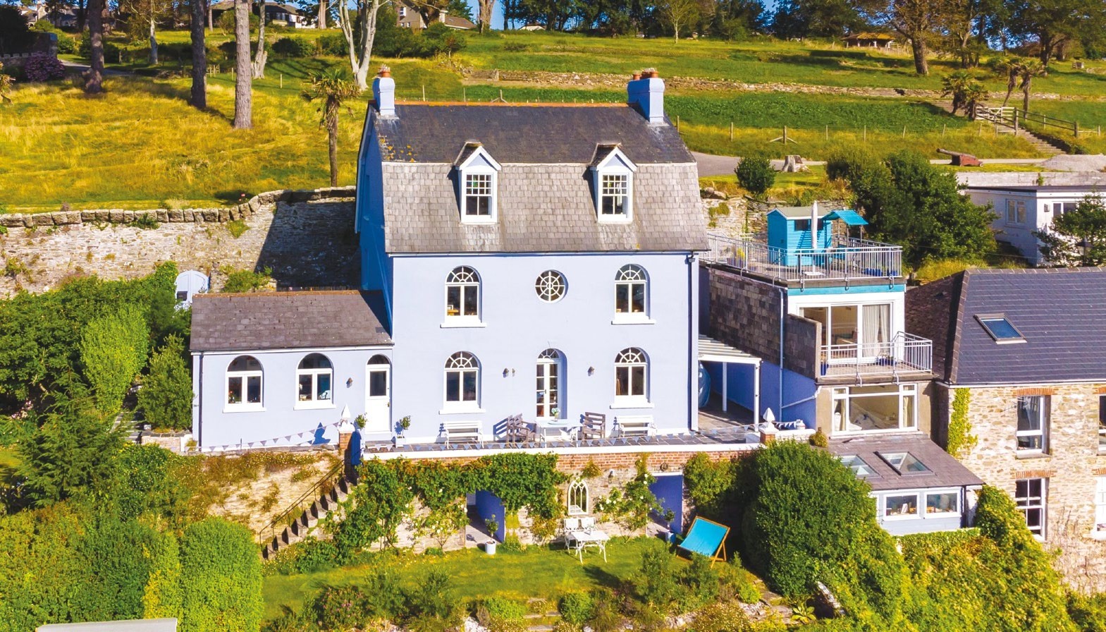Cornwall: Toads Place, Fowey. A landmark Georgian house, enjoying panoramic southerly views of the harbour and Pont Pill. 6 beds (1 en suite), family bath, shower, kitchen/dining room, 2 receps, music room, studio, terraced garden. OIEO £1.85m; Rohrs & Rowe (01872-306360).