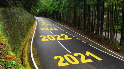 A curvy road with 2021, 2022, 2023, 2024, 2025, etc. painted on it.