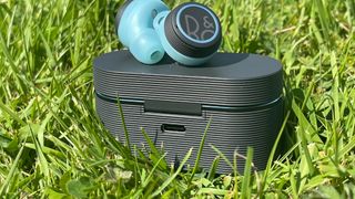 Bang & Olufsen Beoplay E8 Sport earbuds on top of the case
