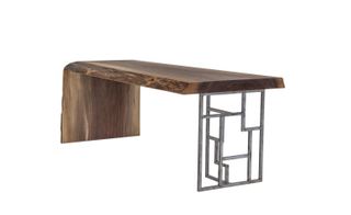 View of the 'Fractal' coffee table - a wooden table with a metal leg that features a geometric pattern