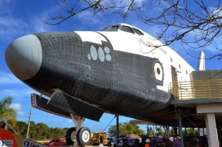 The mock space shuttle "Inspiration," previously named the "Shuttle to Tomorrow," housed a mul-ti-sensory theater and detailed crew cabin at the U.S. Astronaut Hall of Fame in Florida.