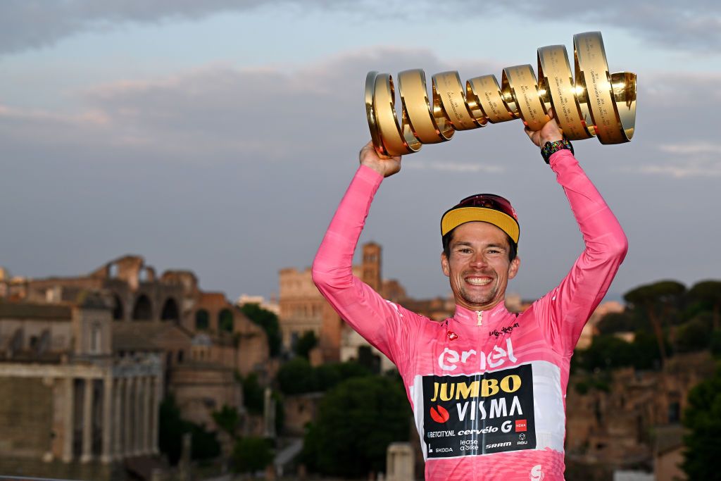 ROME ITALY MAY 28 Primo Rogli of Slovenia and Team JumboVisma Pink Leader Jersey celebrates with the Trofeo Senza Fine as final overall race winner during the 106th Giro dItalia 2023 Stage 21 a 126km stage from Rome to Rome UCIWT on May 28 2023 in Rome Italy Photo by Stuart FranklinGetty Images