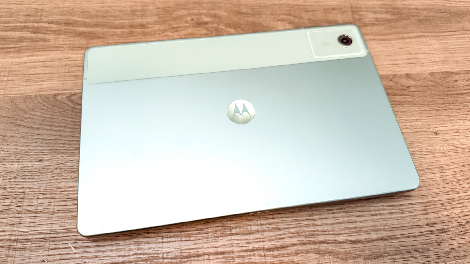 The Motorola MotoPad (2026) face down on a table showing off its design
