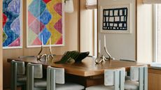 a modern dining room with pale white grey blue chairs around the table