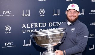 Tyrrell Hatton holds the Alfred Dunhill Championship trophy