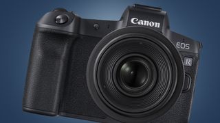 The original Canon EOS R camera on a blue background