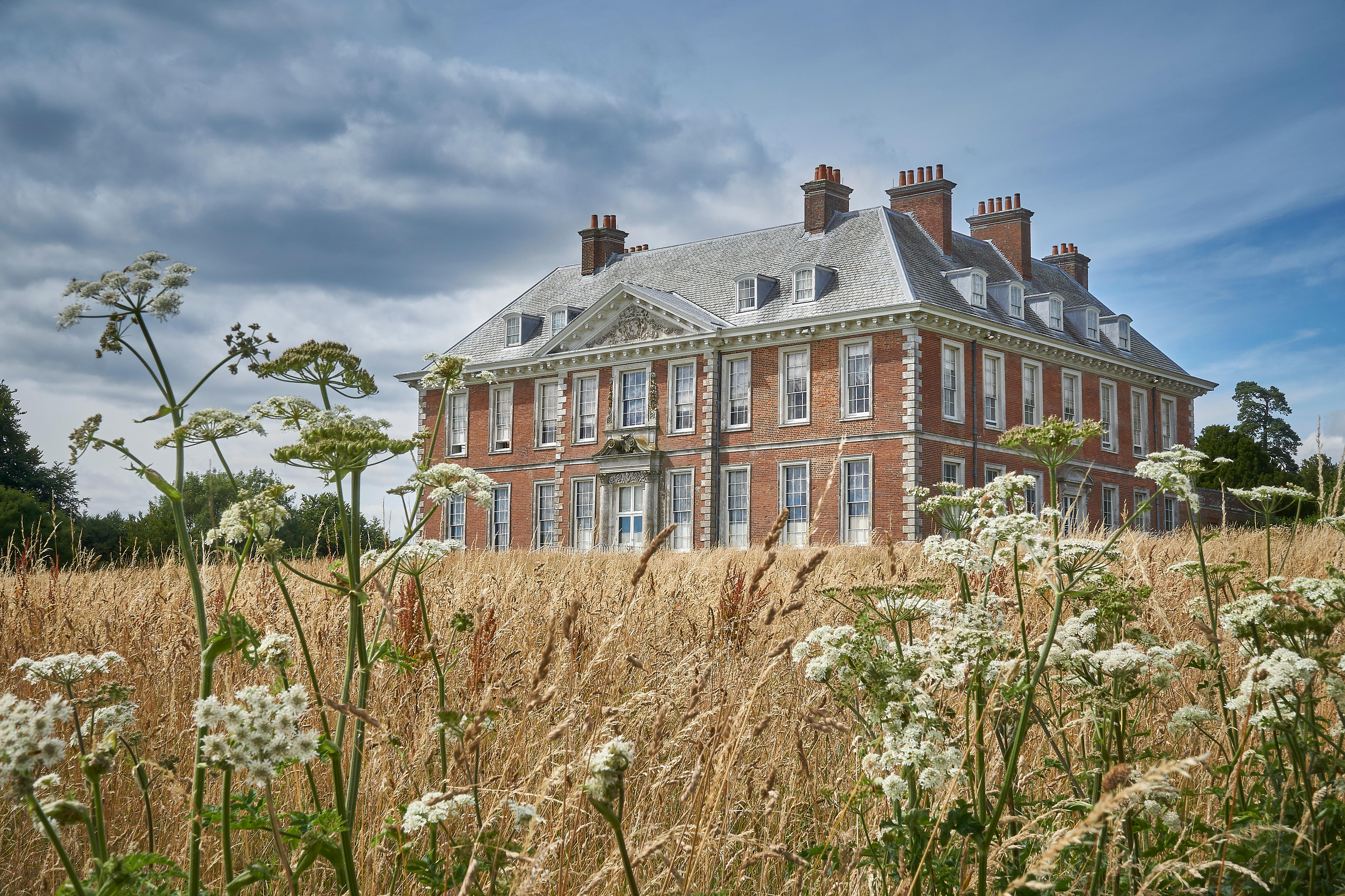 Uppark House standing in a meadow
