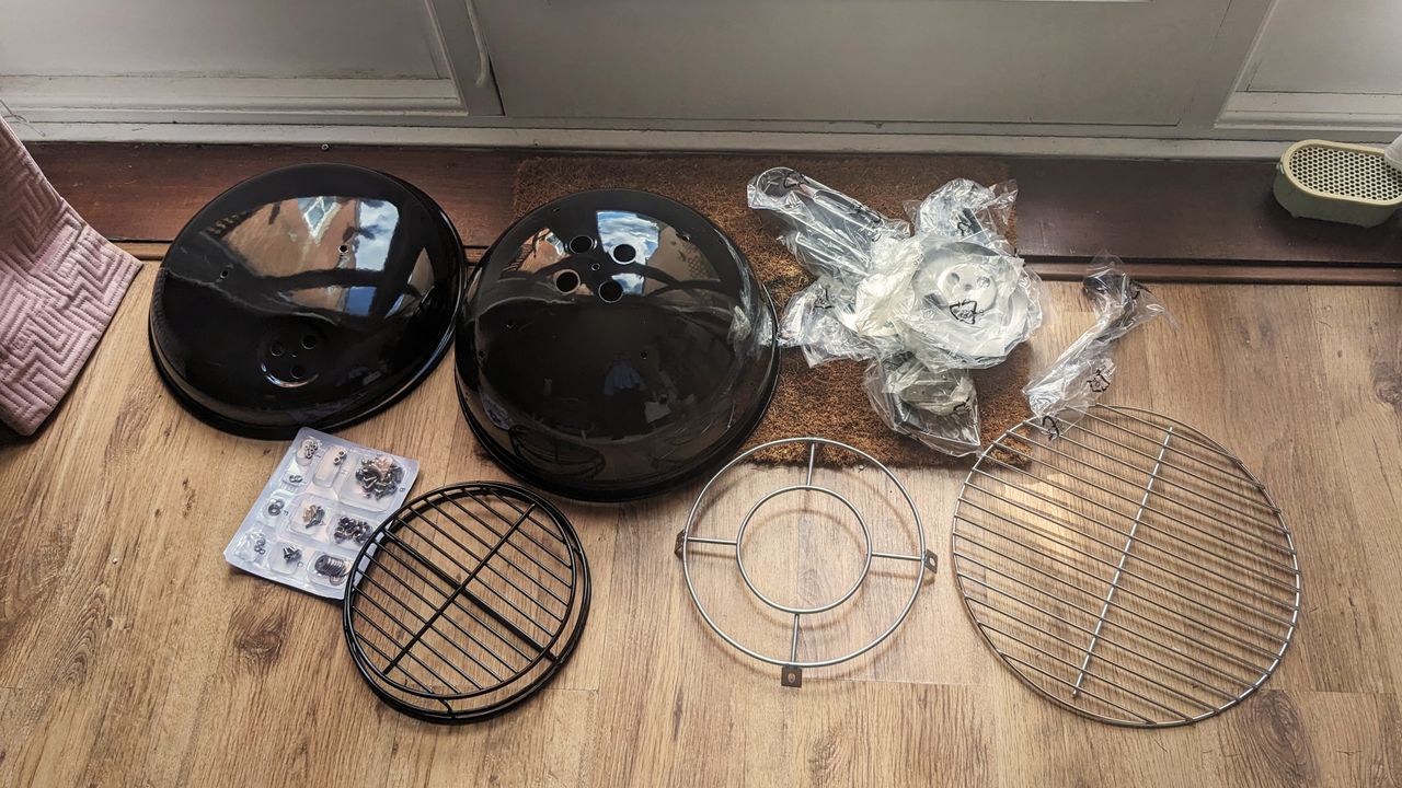 Napoleon NK14 Portable Charcoal Kettle Grill being tested in writer's home