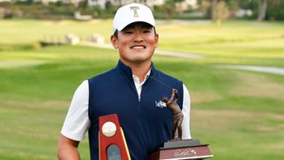 Hiroshi Tai with the NCAA Division I Championship trophy