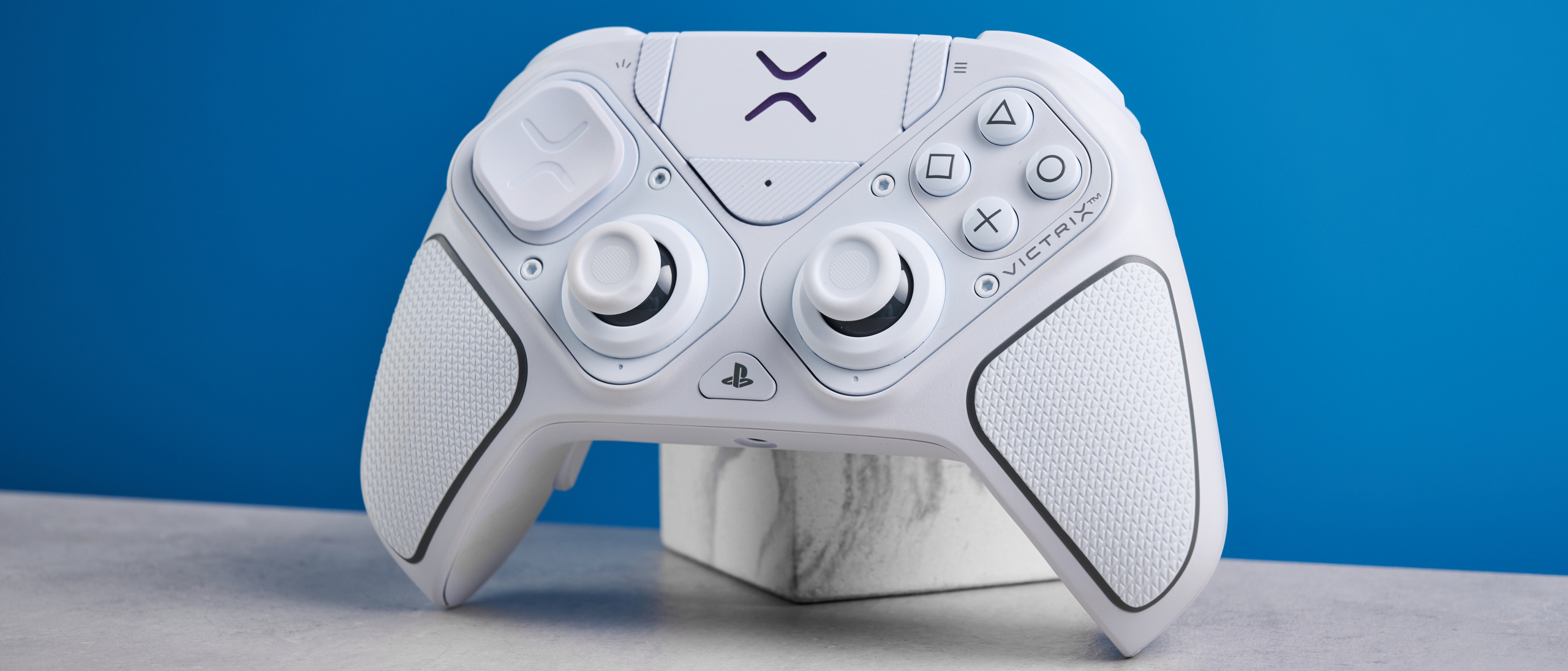 A white Turtle Beach Victrix Pro BFG Reloaded controller for the PS5