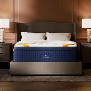 DreamCloud Premier Rest Hybrid Mattress on a bed.