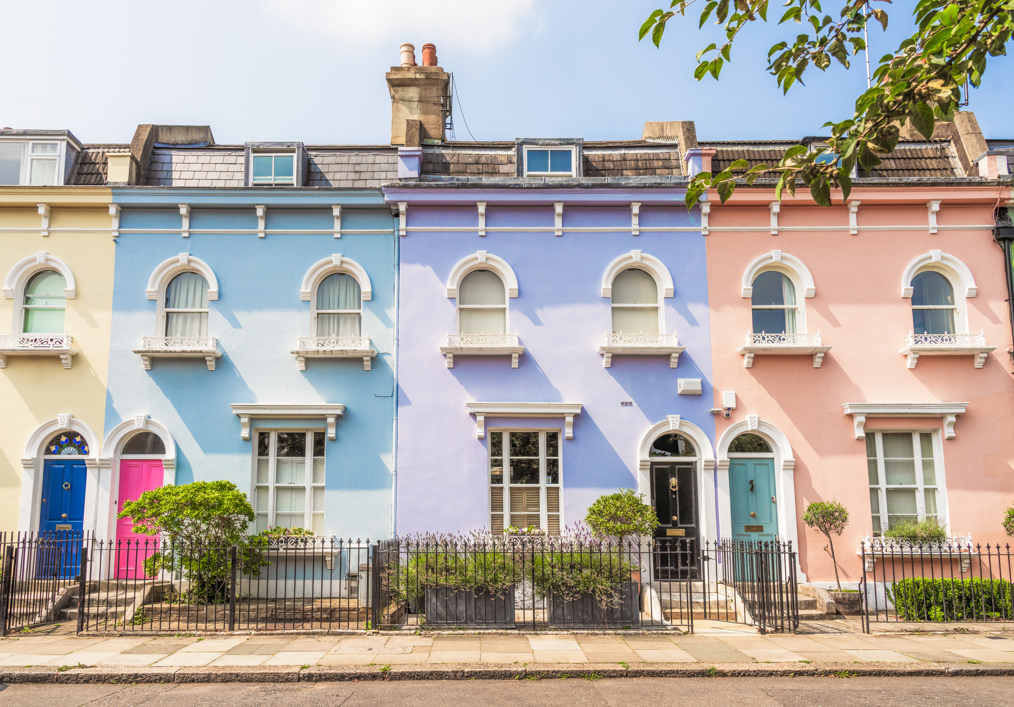 Street of multi-coloured terraced houses in London 