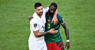 Cameroon's defender #03 Nicolas Nkoulou (R) hugs Serbia's forward #09 Aleksandar Mitrovic at the end of the Qatar 2022 World Cup Group G football match between Cameroon and Serbia at the Al-Janoub Stadium in Al-Wakrah, south of Doha on November 28, 2022.
