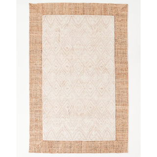 neutral patterned rug with a jute border