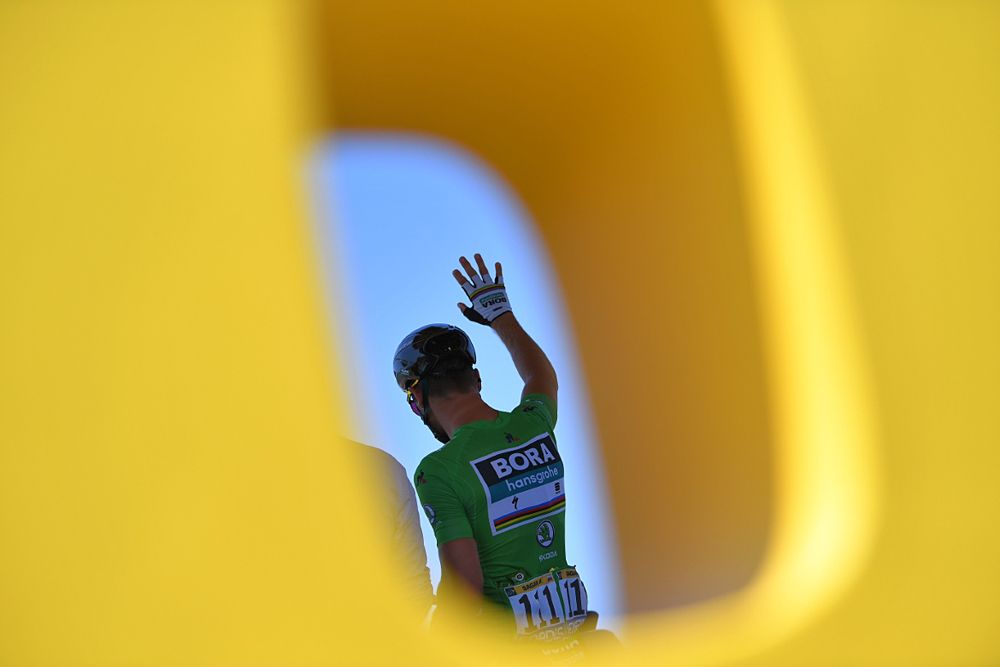 Points leader Peter Sagan waves to the crowd at the start of stage 4 at the Tour de France
