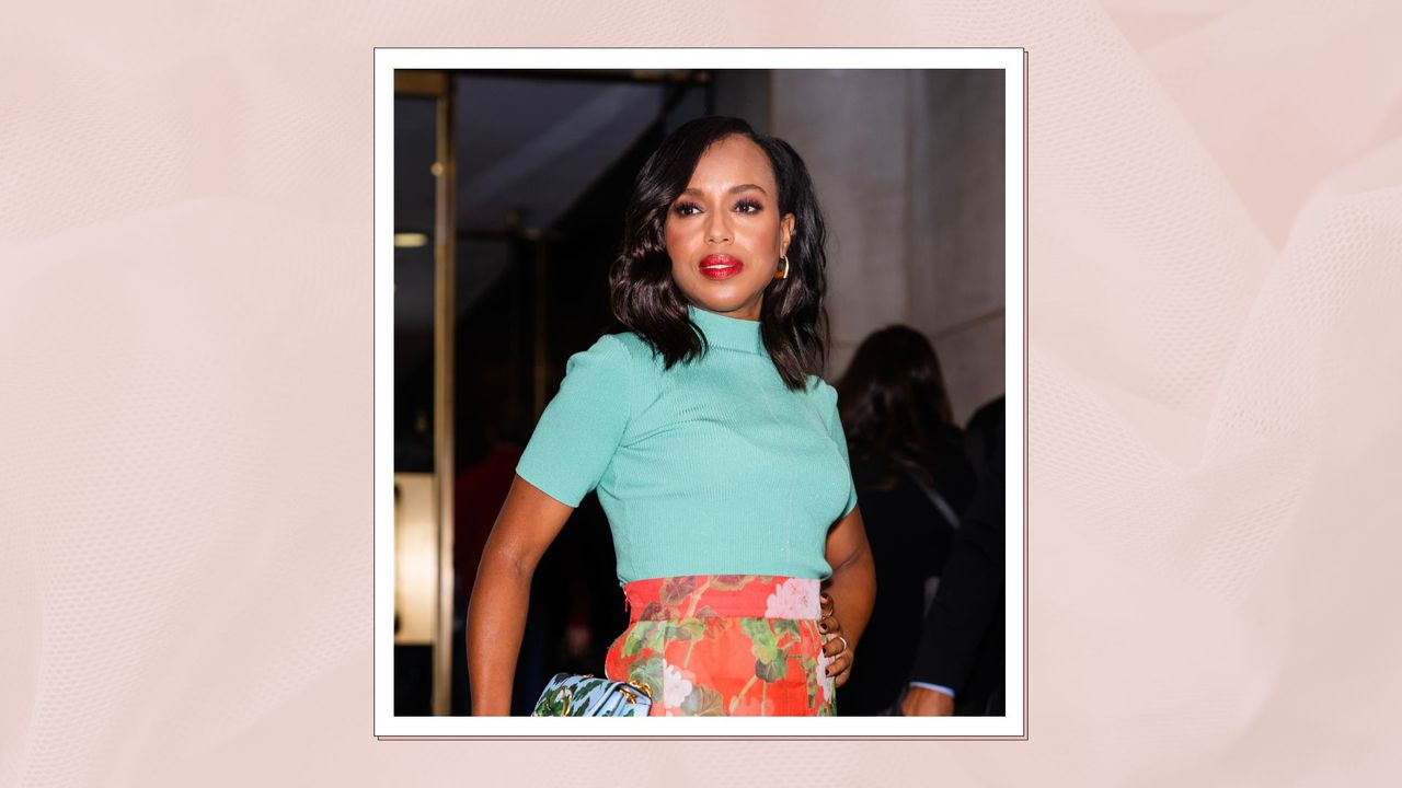 Kerry Washington pictured with bold red lipstick wearing a turquoise blouse and floral-print skirt 