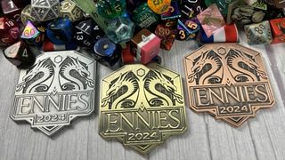 ENNIEs badges beside a dragons hoard of dice