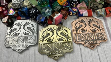 ENNIEs badges beside a dragons hoard of dice