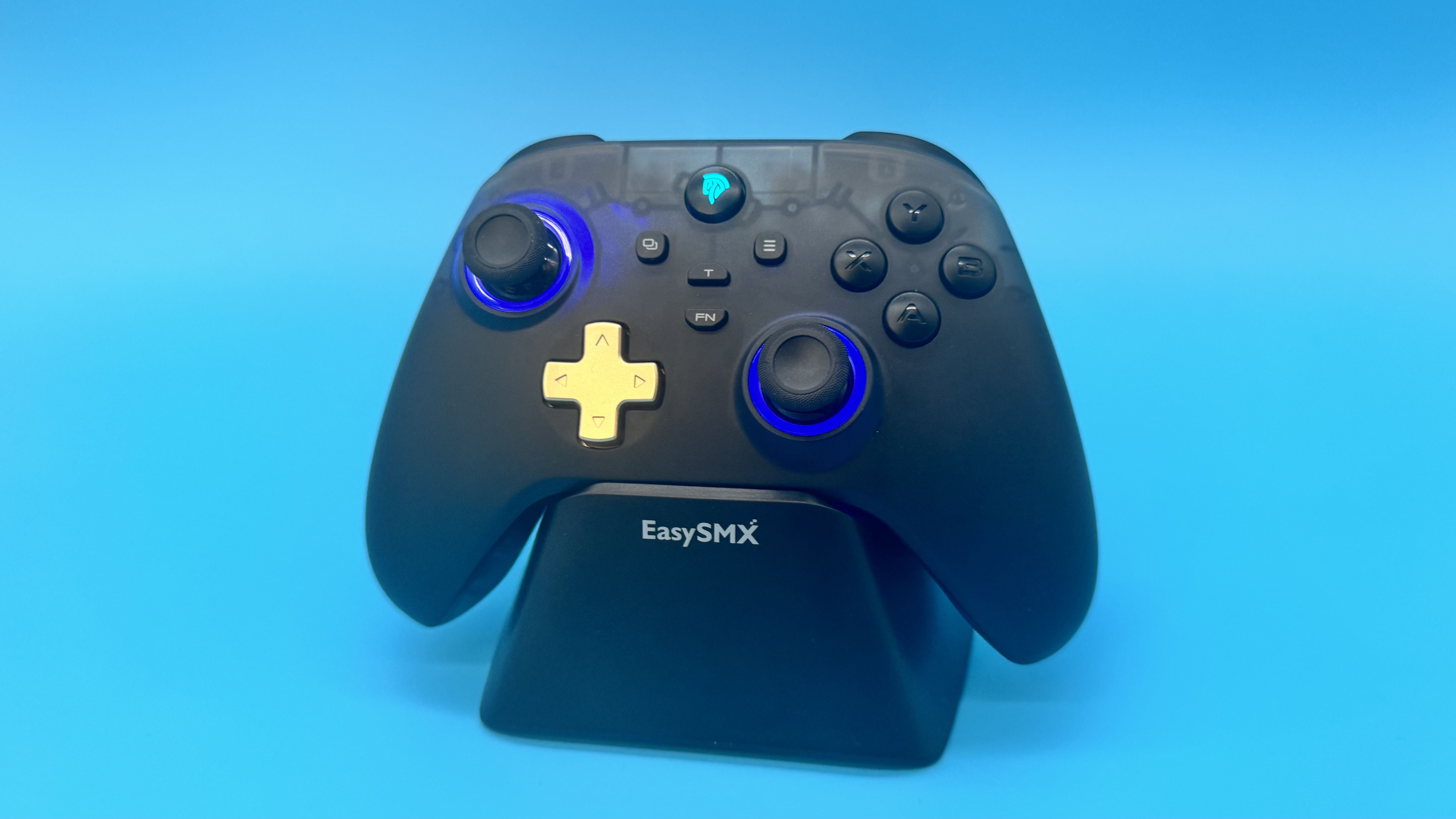 EasySMX D05 black gaming controller from on the front on a charging stand (with blue RGB on) on a blue background