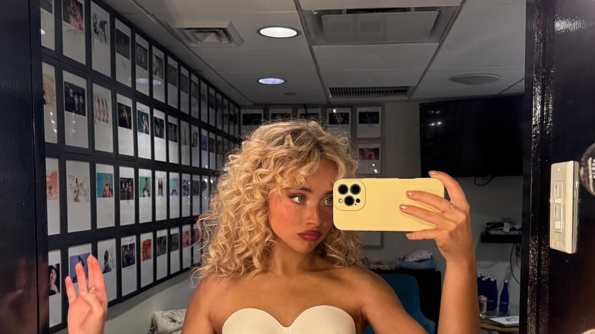 Sabrina Carpenter wearing a sculptural corset and posing with a Chloe Paddington