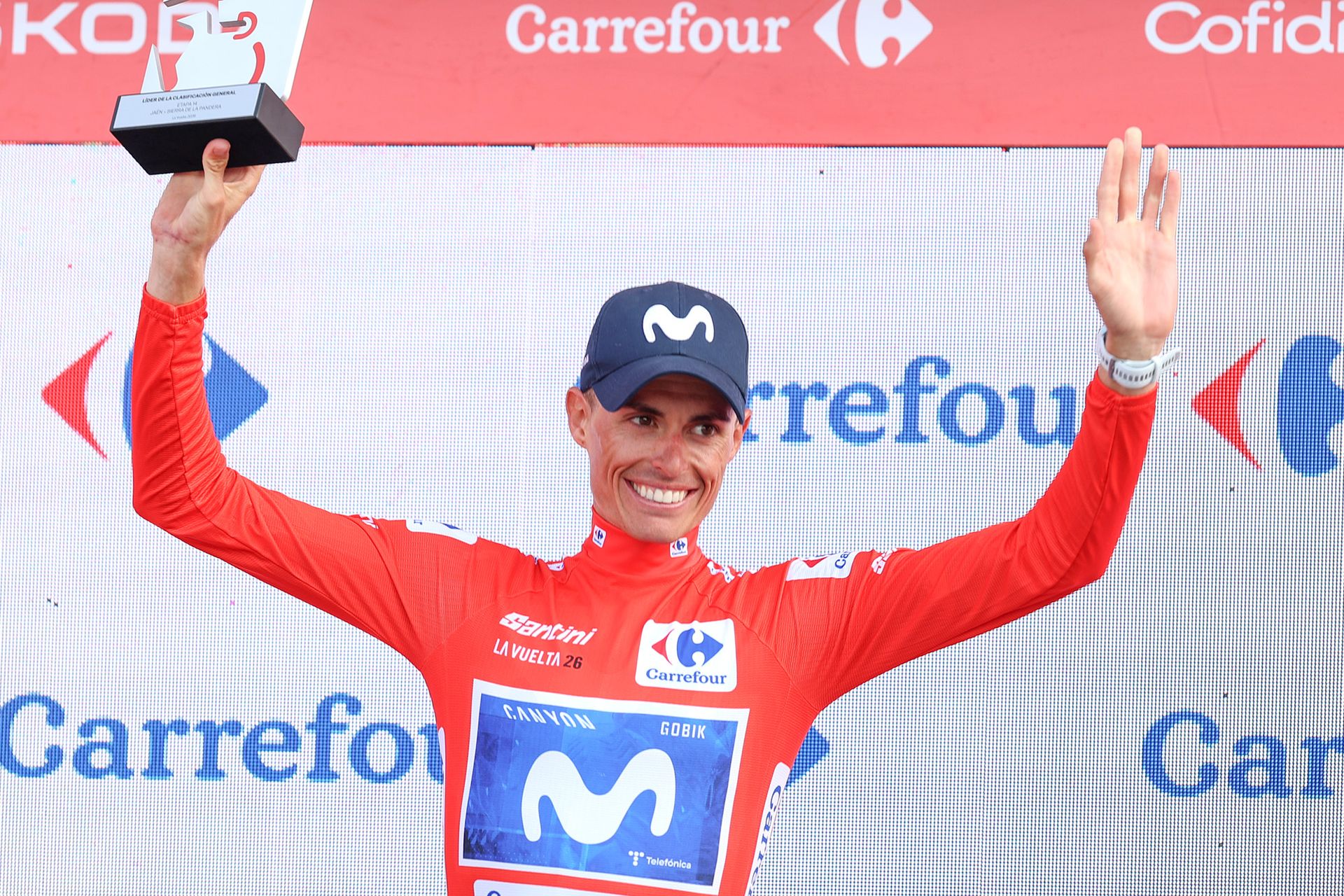 Enric Mas celebrates in the red jersey as Vuelta a España leader after stage 14 of the 2026 race