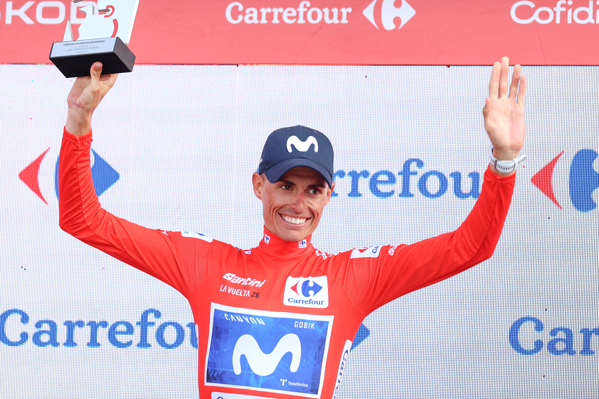 Enric Mas celebrates in the red jersey as Vuelta a Espa&amp;ntilde;a leader after stage 14 of the 2026 race