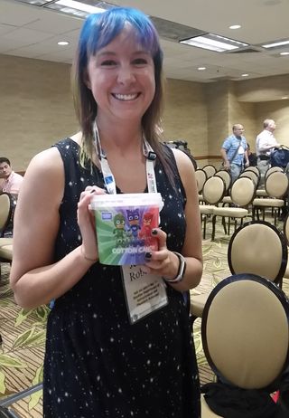 Graduate student Jessica Roberts holds a tub of cotton candy to illustrate the density of two exoplanets, Kepler-51b and -51d. Roberts dyed her hair "cotton-candy colors" for her presentation to fellow researchers last month at the American Astronomical Society summer conference.